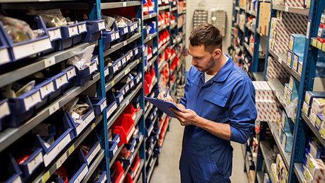 Service technician surveys repair parts for motor claim 