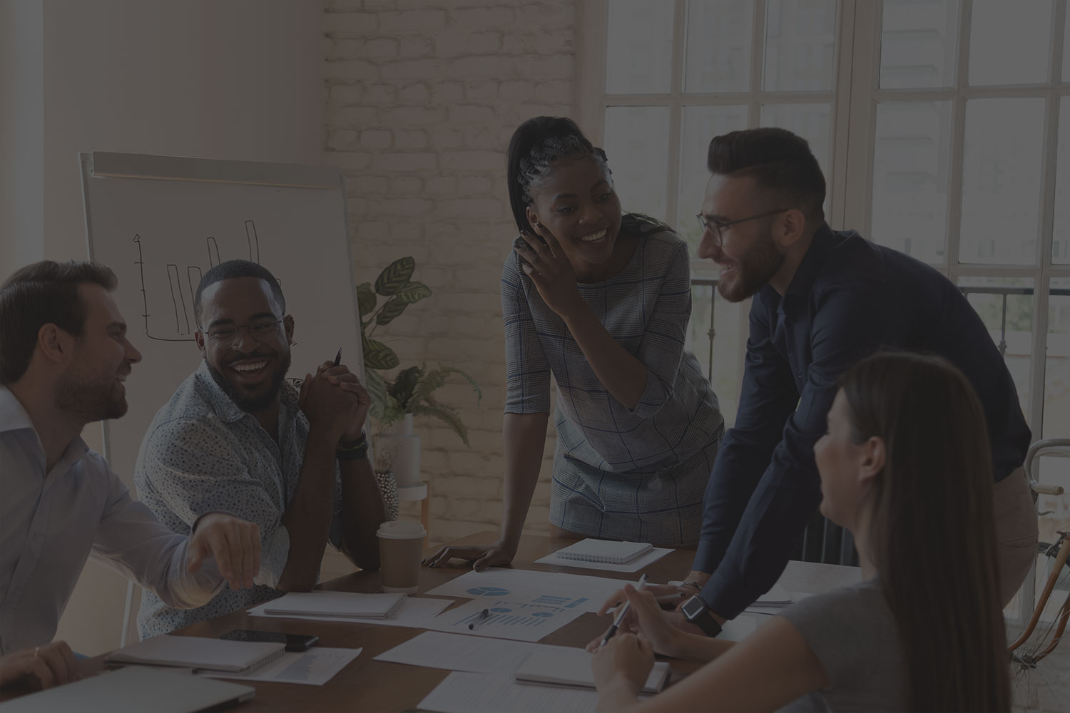 stock-photo-happy-friendly-multiracial-business-team-laughing-working-together-at-corporate-briefing-gathered-1477336820-70-percent-1